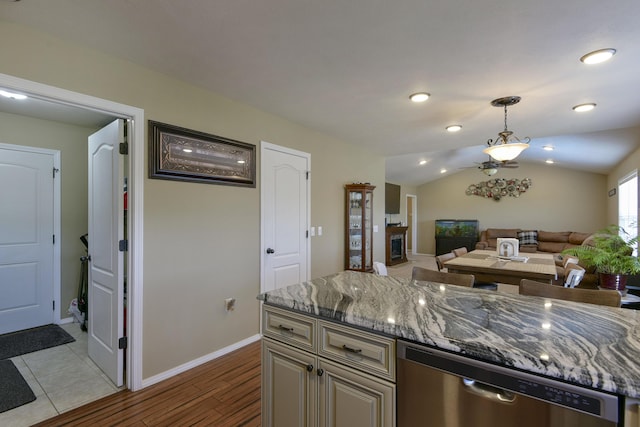 440 Spring Meadow Pkwy, Branson, MO 65616 - kitchen with stainless steel dishwasher, light stone counters, pendant lighting, wood finished floors, and open floor plan