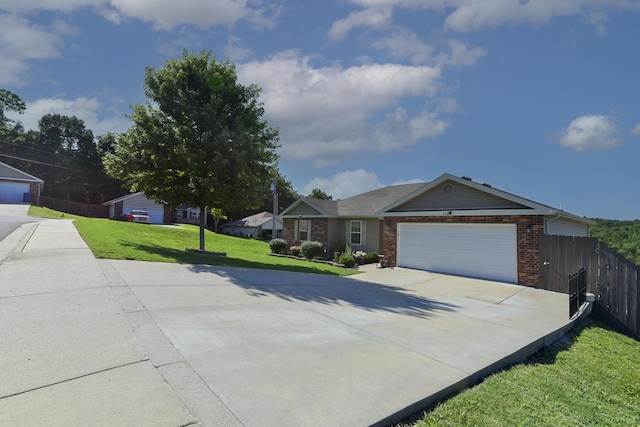 440 Spring Meadow Pkwy, Branson, MO 65616 - ranch-style house with brick siding, driveway, and a garage