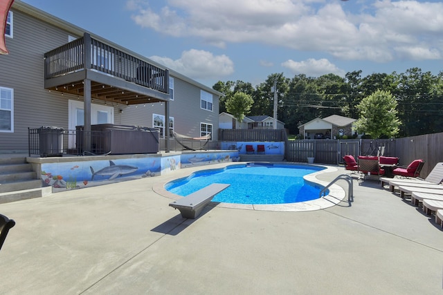 440 Spring Meadow Pkwy, Branson, MO 65616 - view of swimming pool with a hot tub, a patio area, a fenced backyard, and a diving board