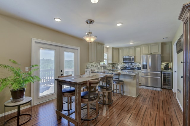 440 Spring Meadow Pkwy, Branson, MO 65616 - dining room with beverage cooler, french doors, dark wood finished floors, and recessed lighting