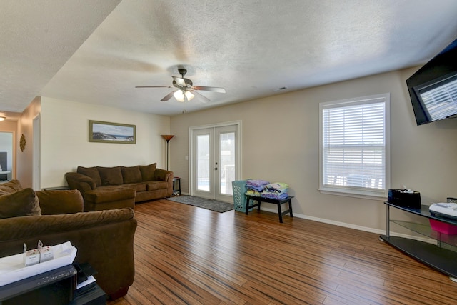 440 Spring Meadow Pkwy, Branson, MO 65616 - living area with french doors, ceiling fan, healthy amount of natural light, hardwood / wood-style floors, and a textured ceiling