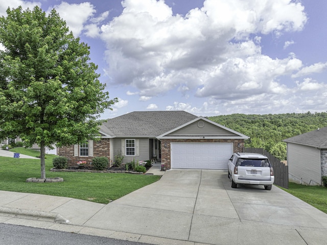440 Spring Meadow Pkwy, Branson, MO 65616 - view of front facade featuring a garage, a front yard, concrete driveway, brick siding, and roof with shingles