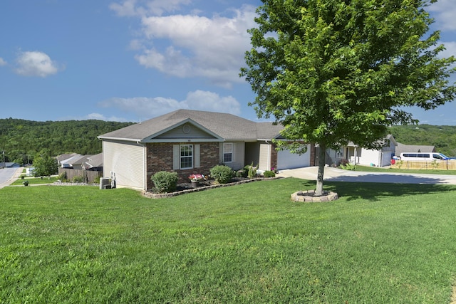 440 Spring Meadow Pkwy, Branson, MO 65616 - ranch-style house featuring a garage, a front lawn, brick siding, and driveway