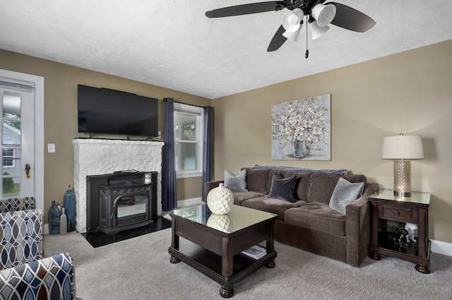 1841 E Dale St, Springfield, MO 65803 - living area with carpet flooring, a textured ceiling, and a ceiling fan