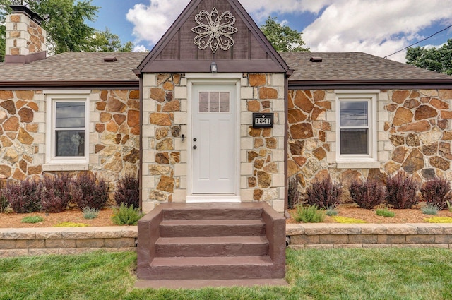1841 E Dale St, Springfield, MO 65803 - doorway to property featuring stone siding, roof with shingles, and a chimney