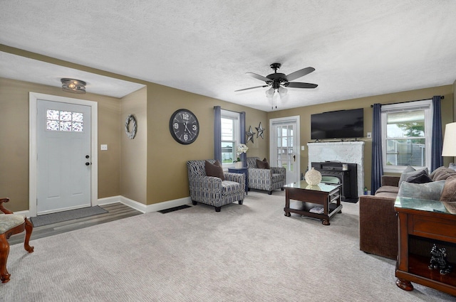1841 E Dale St, Springfield, MO 65803 - carpeted living room with a ceiling fan and baseboards