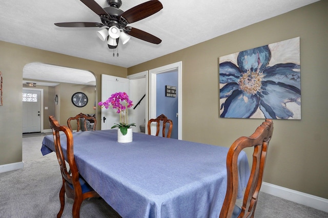 1841 E Dale St, Springfield, MO 65803 - carpeted dining space featuring ceiling fan and arched walkways