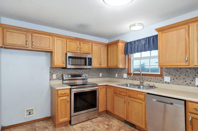 1603 W Robin St, Ozark, MO 65721 - kitchen with stainless steel appliances, backsplash, and light countertops