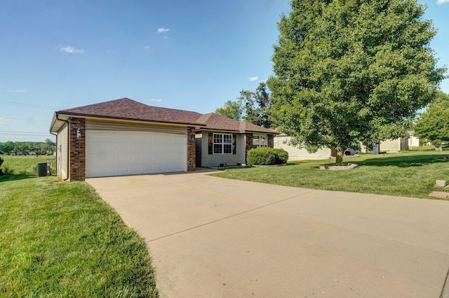 1603 W Robin St, Ozark, MO 65721 - ranch-style home with an attached garage, a front yard, driveway, and brick siding