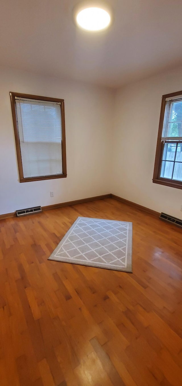 918 E Mcgee St, Springfield, MO 65807 - spare room featuring wood finished floors and baseboards