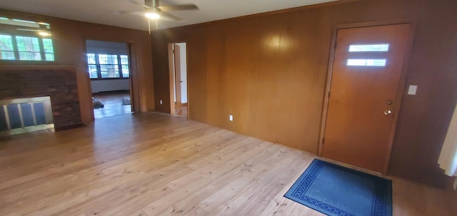 918 E Mcgee St, Springfield, MO 65807 - foyer entrance with a ceiling fan, a brick fireplace, and wood finished floors