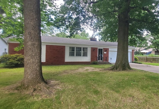 918 E Mcgee St, Springfield, MO 65807 - single story home featuring an attached garage, driveway, brick siding, and a chimney
