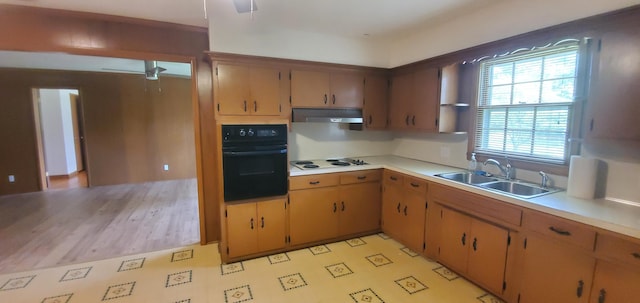 918 E Mcgee St, Springfield, MO 65807 - kitchen featuring oven, under cabinet range hood, white cooktop, light countertops, and open shelves