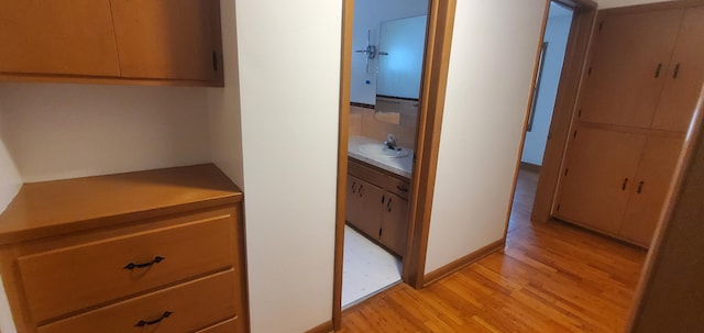 918 E Mcgee St, Springfield, MO 65807 - hall featuring light wood-style floors and a sink