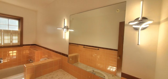 918 E Mcgee St, Springfield, MO 65807 - full bath featuring a bath, tile walls, and a wainscoted wall