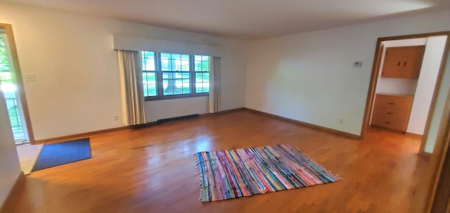 918 E Mcgee St, Springfield, MO 65807 - unfurnished room with wood finished floors and baseboards