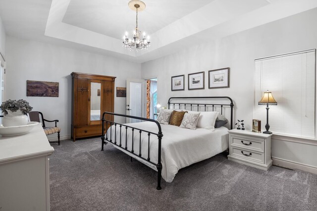253 Cedar Glade Dr, Branson West, MO 65737 - bedroom with dark carpet and a chandelier