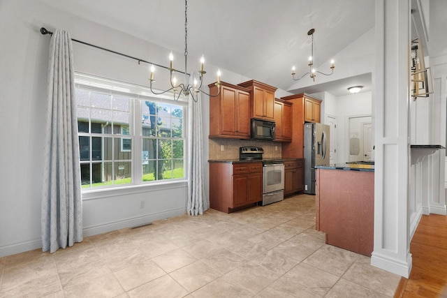 253 Cedar Glade Dr, Branson West, MO 65737 - kitchen with appliances with stainless steel finishes, a chandelier, dark countertops, brown cabinets, and vaulted ceiling
