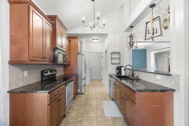253 Cedar Glade Dr, Branson West, MO 65737 - kitchen with stainless steel appliances, a chandelier, vaulted ceiling, backsplash, and brown cabinets