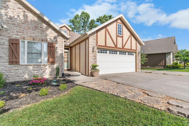 253 Cedar Glade Dr, Branson West, MO 65737 - view of front of house with stone siding, concrete driveway, a garage, stucco siding, and roof with shingles