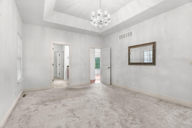 253 Cedar Glade Dr, Branson West, MO 65737 - unfurnished room featuring a chandelier, carpet flooring, and a high ceiling