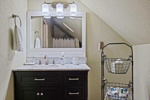 26474 Kings River Rd, Shell Knob, MO 65747 - bathroom featuring vanity, a textured wall, a shower with shower curtain, a chandelier, and vaulted ceiling
