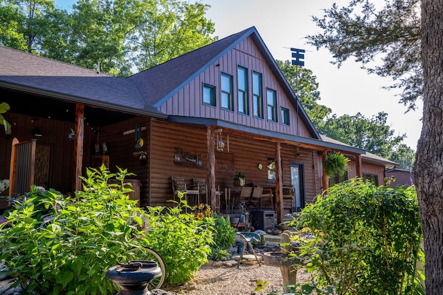 26474 Kings River Rd, Shell Knob, MO 65747 - rear view of property featuring a shingled roof, board and batten siding, and a chimney