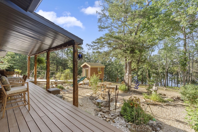26474 Kings River Rd, Shell Knob, MO 65747 - deck featuring a storage shed and view of scattered trees