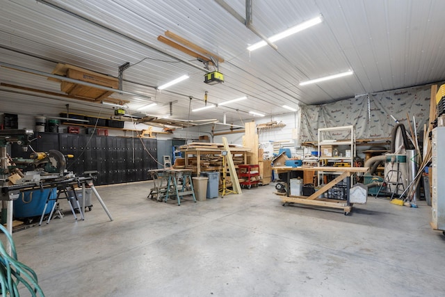26474 Kings River Rd, Shell Knob, MO 65747 - garage with a workshop area and a garage door opener