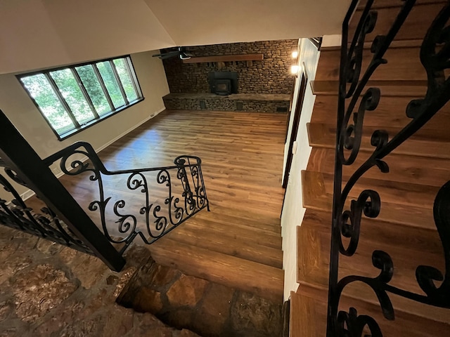 805 E 13th St, Cassville, MO 65625 - stairway with a wood stove and wood finished floors