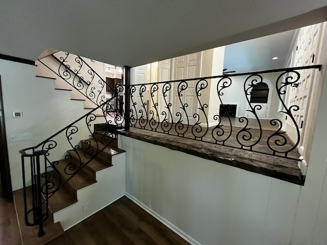 805 E 13th St, Cassville, MO 65625 - stairway featuring wood finished floors and baseboards
