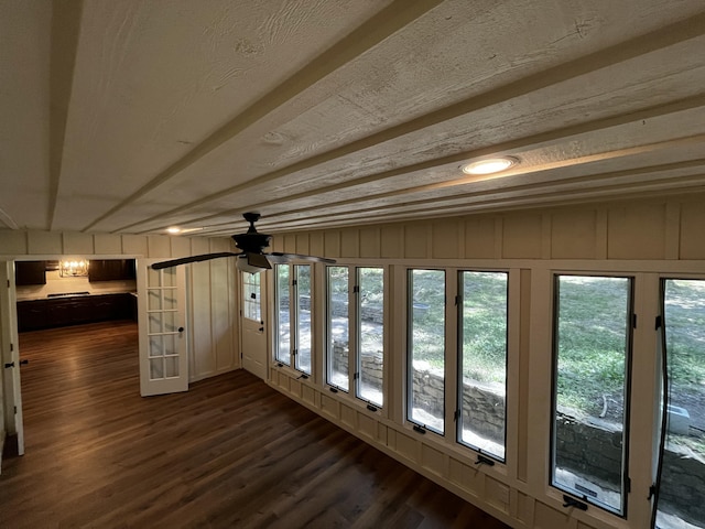 805 E 13th St, Cassville, MO 65625 - unfurnished sunroom with wood finished floors and a decorative wall