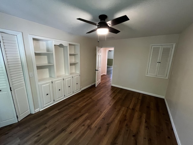 805 E 13th St, Cassville, MO 65625 - unfurnished room with dark wood-style flooring, a ceiling fan, and built in features