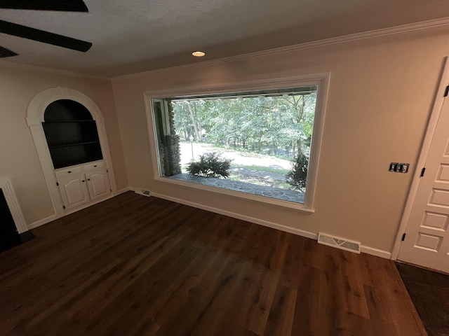 805 E 13th St, Cassville, MO 65625 - unfurnished living room with ornamental molding, healthy amount of natural light, and dark wood finished floors