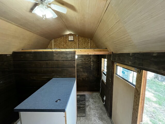 805 E 13th St, Cassville, MO 65625 - additional living space with vaulted ceiling, carpet, a ceiling fan, and wooden walls