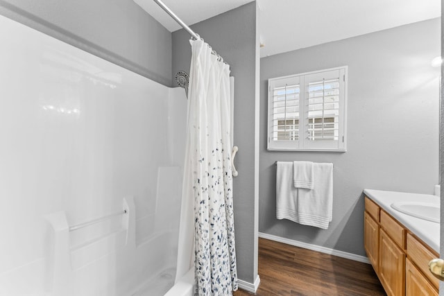 295 Deer Run Rd, Branson, MO 65616 - bathroom with vanity, wood finished floors, and shower / tub combo with curtain