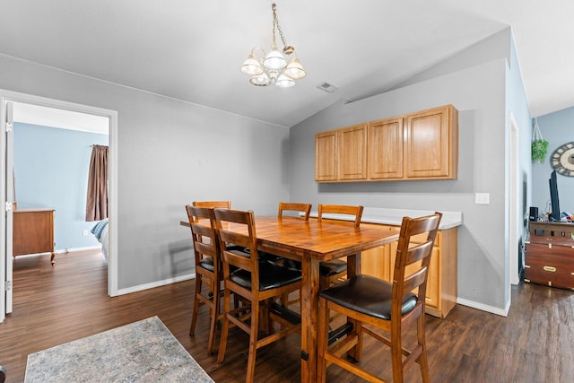 295 Deer Run Rd, Branson, MO 65616 - dining area with lofted ceiling, dark wood-type flooring, and a chandelier