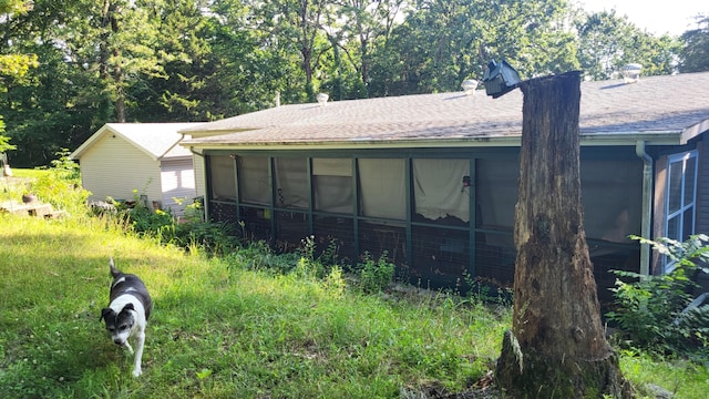 210 Castle Rock Dr, Kissee Mills, MO 65680 - view of side of home with a sunroom and a shingled roof