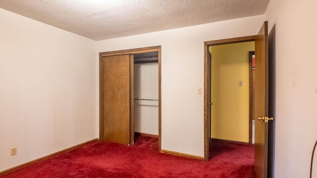 619 9th St, Thayer, MO 65791 - unfurnished bedroom featuring dark colored carpet, a closet, and a textured ceiling
