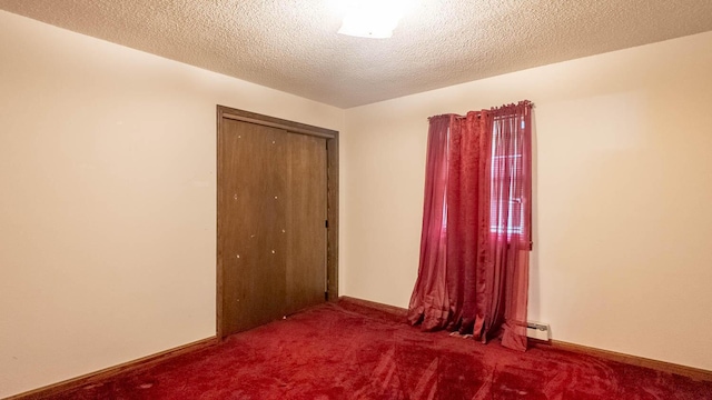 619 9th St, Thayer, MO 65791 - empty room featuring carpet flooring, baseboard heating, and a textured ceiling