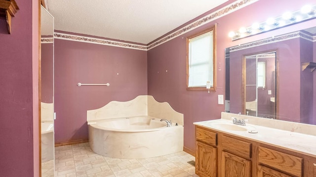 619 9th St, Thayer, MO 65791 - bathroom with a garden tub, vanity, and a textured ceiling
