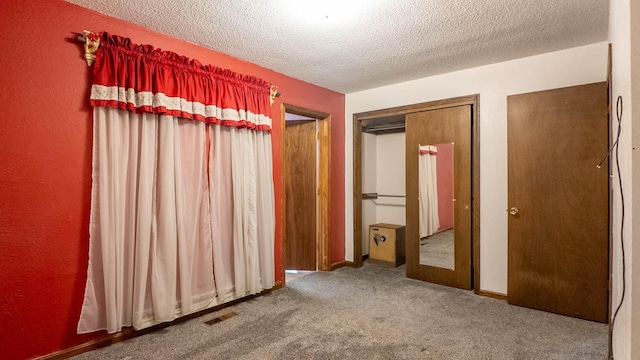 619 9th St, Thayer, MO 65791 - unfurnished bedroom featuring carpet flooring and a textured ceiling