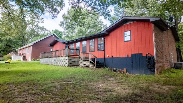 619 9th St, Thayer, MO 65791 - view of property exterior featuring stairway, a wooden deck, and a lawn