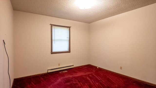 619 9th St, Thayer, MO 65791 - carpeted spare room with baseboard heating and a textured ceiling