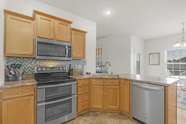 3790 W Rockwood St, Springfield, MO 65807 - kitchen featuring stainless steel appliances, a peninsula, backsplash, light tile patterned flooring, and a chandelier