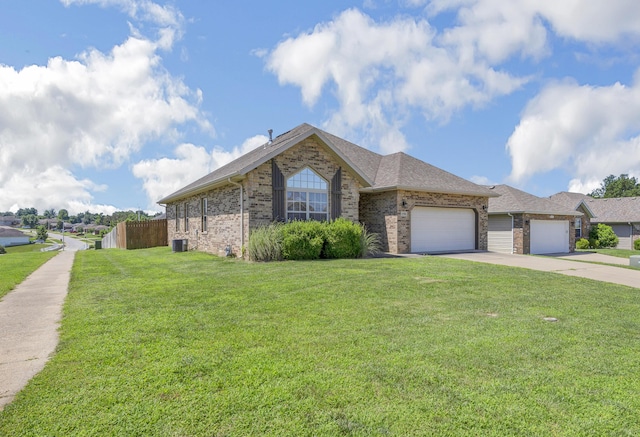 3790 W Rockwood St, Springfield, MO 65807 - view of front of property with a garage, concrete driveway, brick siding, and a shingled roof