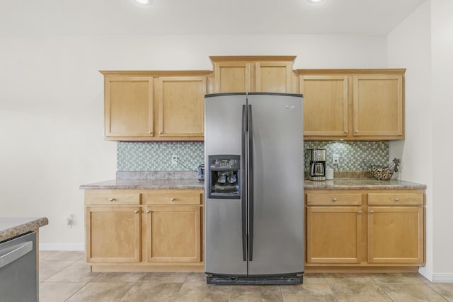 3790 W Rockwood St, Springfield, MO 65807 - kitchen with appliances with stainless steel finishes, backsplash, and light stone counters