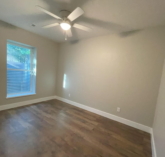 24136 Lazy Daze Ln, Wheatland, MO 65779 - spare room with dark wood finished floors and ceiling fan