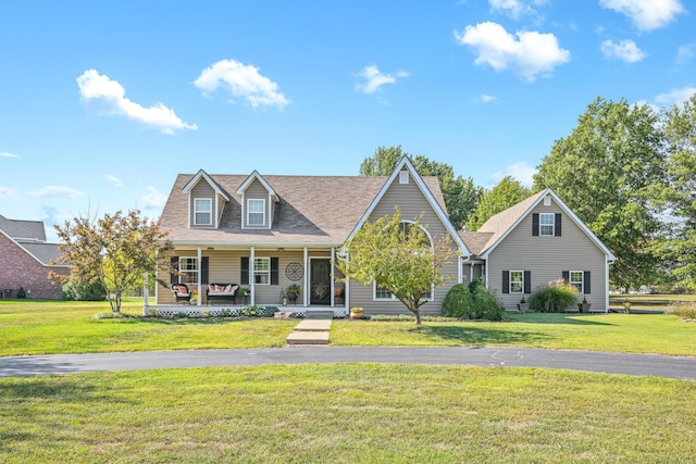 1617 Alexandra Dr, Carthage, MO 64836 - view of front of property with a porch, a front lawn, and roof with shingles