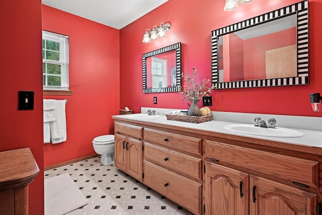 1617 Alexandra Dr, Carthage, MO 64836 - full bath with double vanity, tile patterned floors, and a textured ceiling